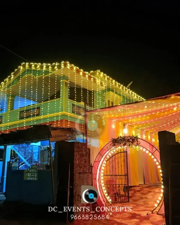 We bring the celebration to your home with festive house lighting and a beautifully decorated entrance pandal. The warm lights create a welcoming glow for any auspicious occasion.