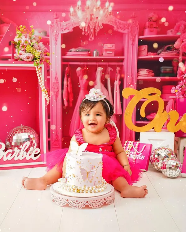 A full view of our delightful Barbie-themed first birthday setup. We create an entire world for your little one to celebrate in, making their cake smash session truly magical.