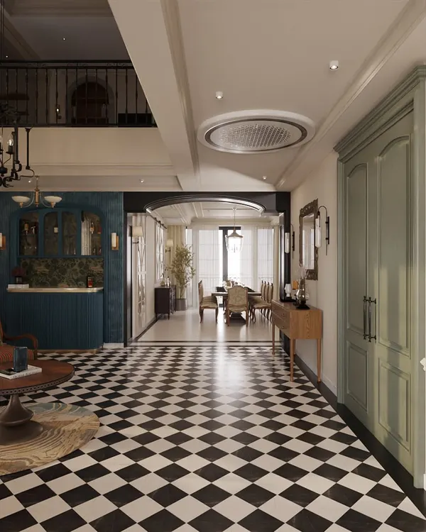 This view showcases the home's dynamic flow, with bold black-and-white checkered flooring leading the eye from a cozy seating area towards the formal dining room. We use distinct flooring and architectural arches to define zones within an open-concept layout.