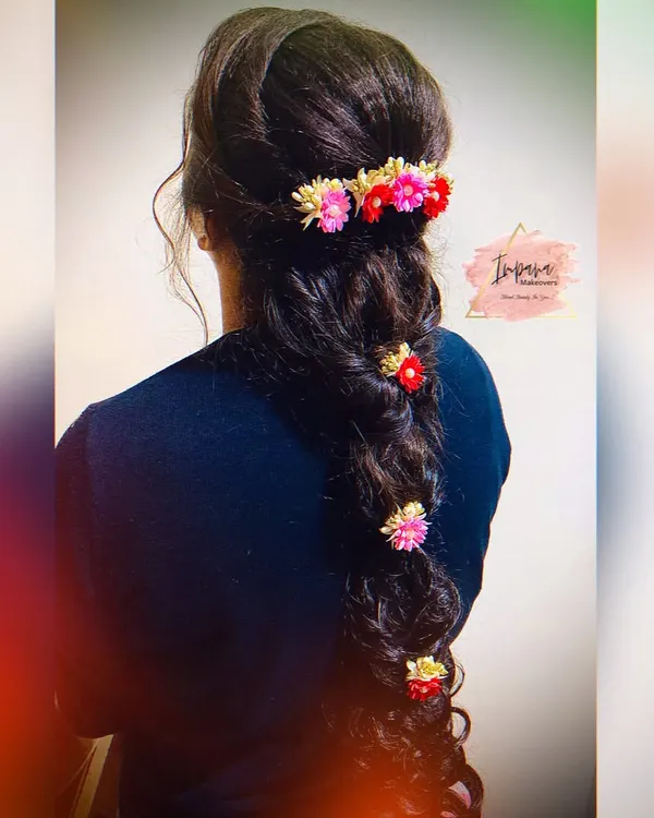 This advance hairstyle with a messy braid and delicate floral accessories was created during one of my hairstyle classes. I teach the techniques to create volume, texture, and secure accessories perfectly.