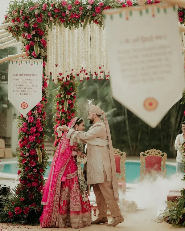 The moment of union during the Varmala ceremony. I captured the groom placing the garland on his bride, with smoke effects adding a touch of magic to this sacred tradition.