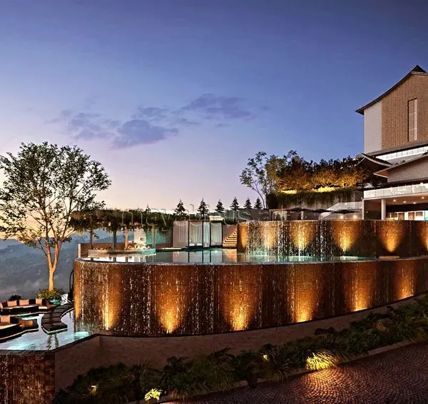 A breathtaking, three-tiered infinity pool at a Solan resort, appearing to merge with the valley below. This design symbolizes ultimate luxury, creating an illusion of water flowing into the sky and offering an unforgettable experience of nature's beauty.