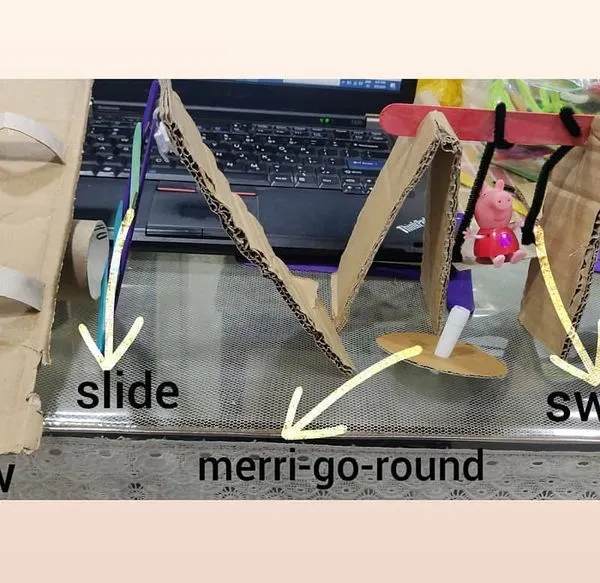We brought the playground home by building our own miniature version from cardboard. This STEAM project included a working see saw, a slide, and a swing, teaching the kids basic mechanics and engineering principles while they built their dream park.