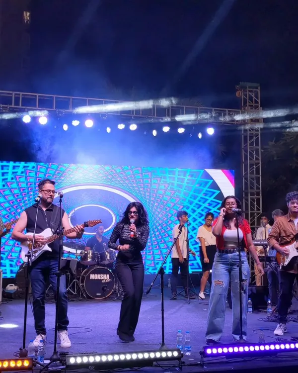 A smashing show with the Moksha All Stars on a big outdoor stage. You can see the full band setup and the energy we bring to large events, complete with backing vocalists and a dynamic stage presence.