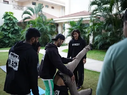 We offer customized corporate wellness events. Here we are guiding the team from Polkadot through a handstand workshop, helping them build trust and try something new together.