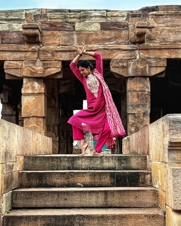 Striking a classical dance pose on the steps of a historic temple. The architecture and energy of these ancient sites are a huge source of inspiration for my dance.