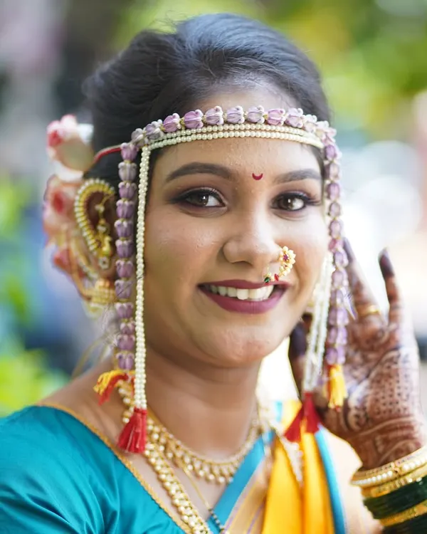 A radiant Maharashtrian bride on her wedding day. My focus is on creating a look that is both timeless and glowing, ensuring your natural beauty shines through. This makeup is designed to be flawless in photos and in person.