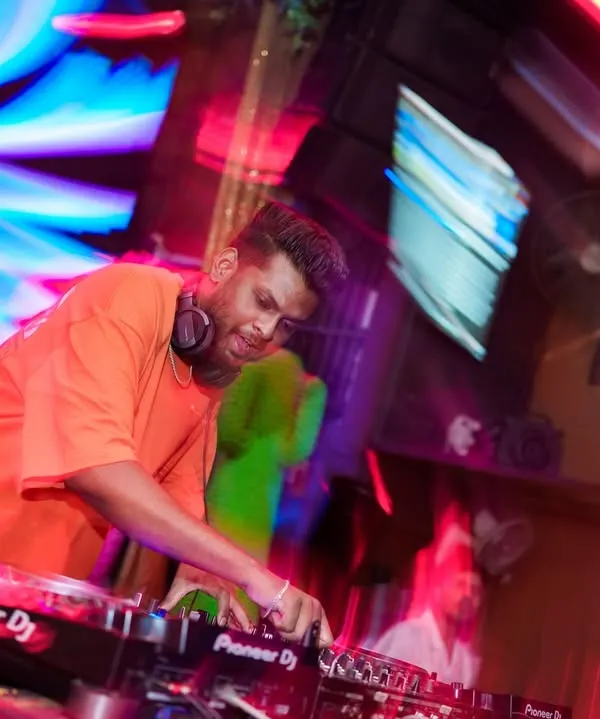 In the zone at Happy Brew, surrounded by motion and light. This action shot captures the high energy environment of a live club set.