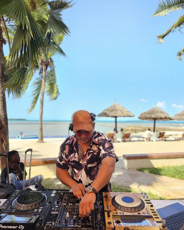DJing on a beautiful beach in Tanzania. For destination parties, I curate a special mix of Afrohouse, house music, and commercial hits to complement the stunning location.
