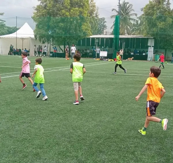 An intense moment from a football match at one of our turf parties. Kids get to experience real teamwork and sportsmanship.