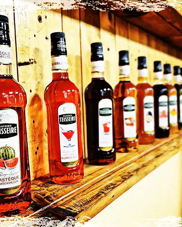 A lineup of Mathieu Teisseire syrups. We work with brands like this to develop recipes and training modules that highlight their range and quality.