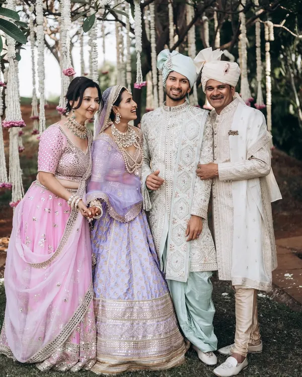 A beautiful family portrait with the couple and their parents. I aim for natural, happy expressions that truly reflect the family's joy on this special day.