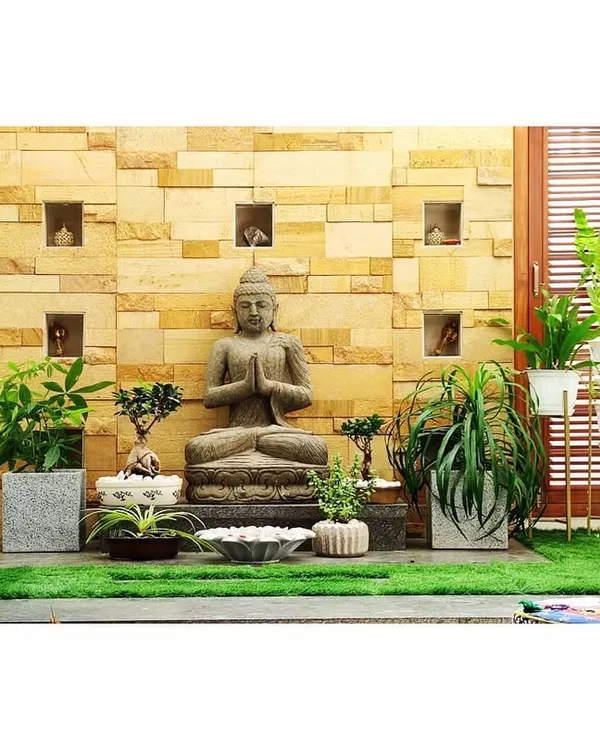 I designed this peaceful indoor courtyard to be a meditation space. It features a Buddha statue, bonsai trees, and other carefully selected plants to create a calm atmosphere.