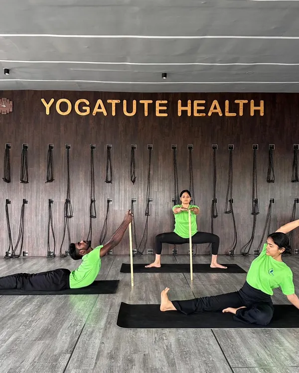 **(Hero Item)** This is the essence of my teaching. Using props like the danda (stick) is not a shortcut; it is a tool for precision. It teaches the body correct alignment, builds strength, and helps you understand the geometry of each asana safely.