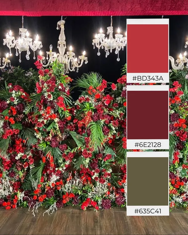 A color palette inspired by passion and luxury. This mood board showcases a theme of deep reds and rich burgundies, set against dark foliage and illuminated by crystal chandeliers, perfect for a glamorous evening reception.