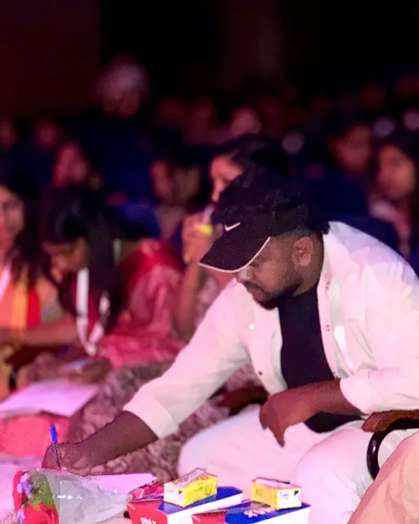 This is me in my element, focused on the performance and taking detailed notes. As a judge, I believe in a structured evaluation, ensuring every ounce of effort from the performers is seen and scored fairly 💫