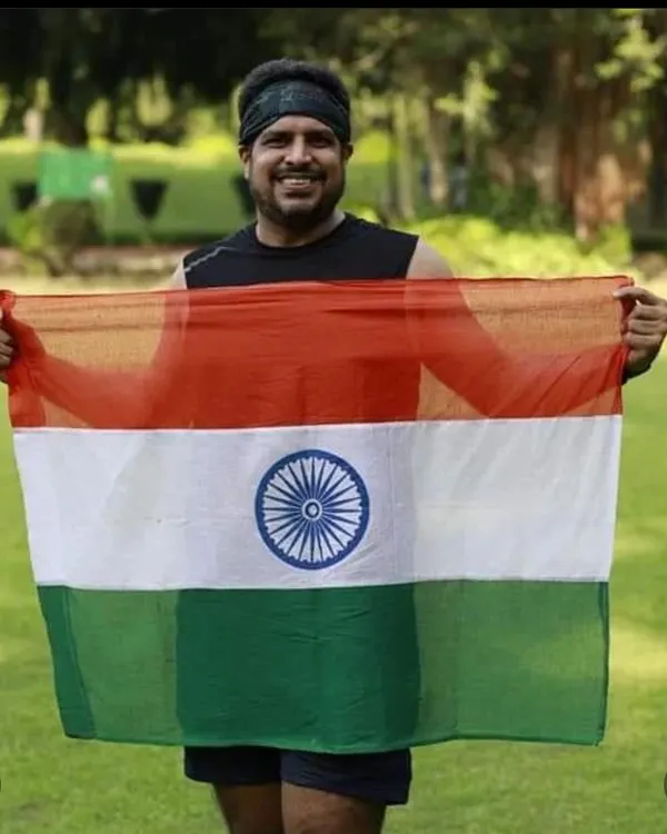 A member holding the Indian flag with pride after an Independence Day run. The feeling of patriotism combined with the runner's high is incredible.