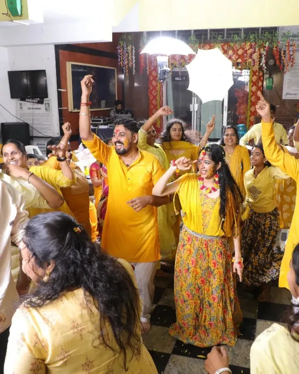The happy couple surrounded by a sea of yellow at their Haldi function. I love organizing dance and games for these events to make them lively and unforgettable.