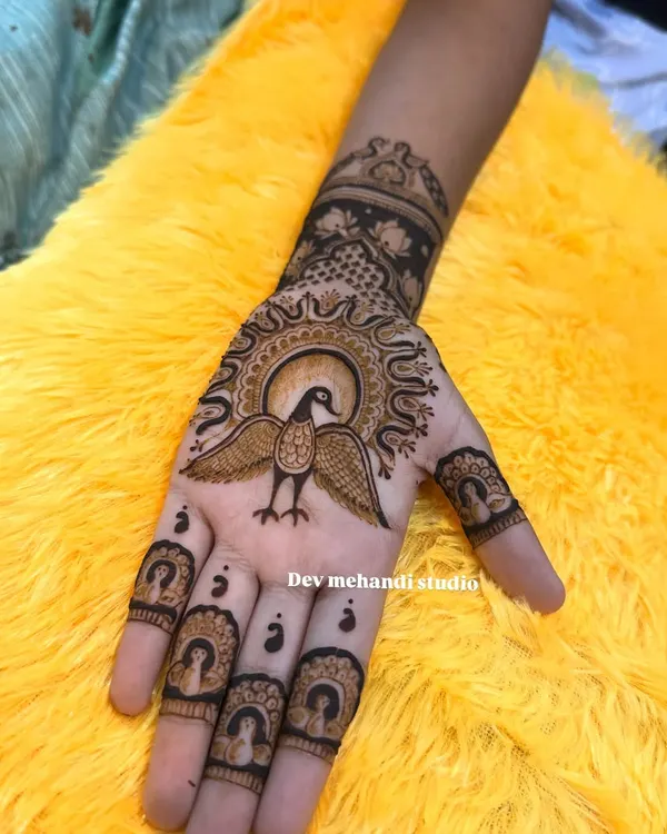 A unique and traditional design featuring a bird with widespread wings on the palm, with portrait details on the fingertips.