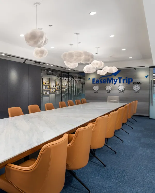 For the EaseMyTrip headquarters, I designed a conference room that feels like a creative summit in the clouds. The custom cloud-like light fixtures float above a long marble table, creating an atmosphere that encourages blue-sky thinking and innovation. This space is a testament to my belief that a meeting room should inspire, not just contain.