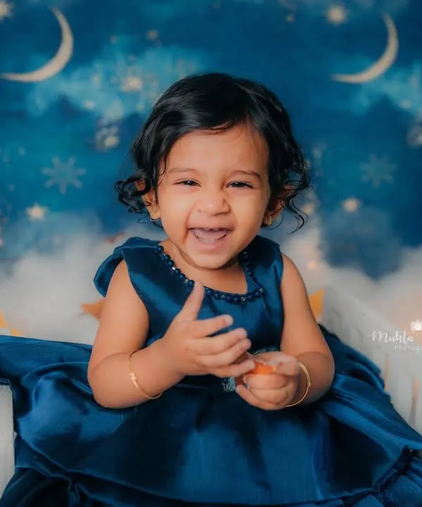 This is the kind of pure, unfiltered joy I live to capture. Her happy laugh during this first birthday shoot just melts my heart and is a perfect example of the beautiful memories we can create together.