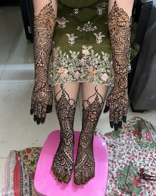 This is what my full bridal mehndi service looks like. I cover the hands and feet with intricate patterns, making sure every detail is perfect for the bride's special day.