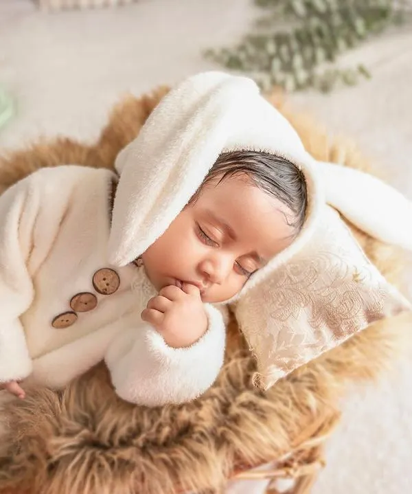 To the most adorable bunny ever. I have a collection of sweet, soft outfits like this one to make your newborn's photos extra cute.