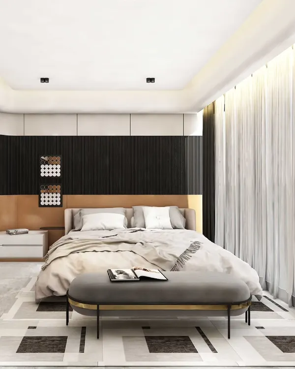 This modern bedroom achieves a refined balance of contrast and calm. A dark, vertically paneled headboard wall provides a textured backdrop for the soft upholstered bed, while a geometric pattern on the floor adds a touch of graphic detail.