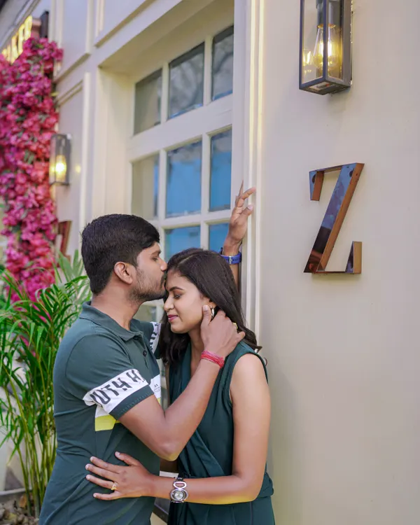 A sweet kiss on the forehead outside a chic city location. Urban photoshoots have a modern and effortlessly cool feel.