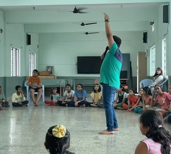 Leading a circle time session at the Kalabhiruchi Shibira summer camp. My goal is to create an energetic and interactive space where kids can learn music fundamentals and overcome any shyness together.