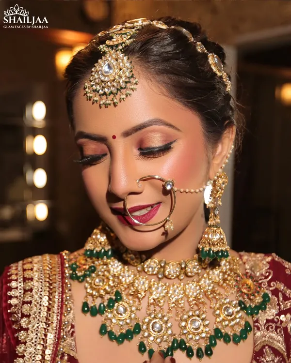 This is the look every bride dreams of. I focus on creating a radiant, flawless base with soft, defined eyes and a bold lip, ensuring you look and feel like royalty on your wedding day. This is achieved with high-end HD makeup for a perfect, long-lasting finish.
