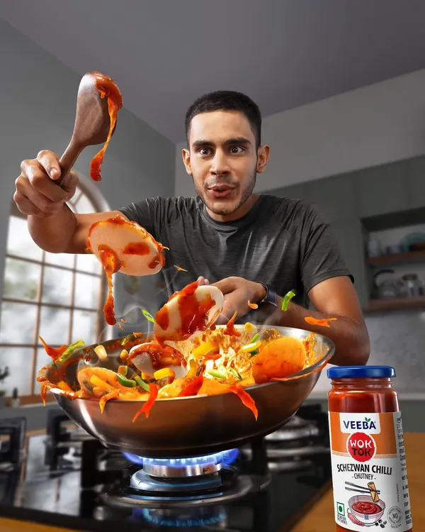 This action shot for Veeba's Schezwan Chilli sauce was all about capturing energy and fun in the kitchen. We worked to freeze the motion of the food tossing in the wok, creating a dynamic and exciting image that makes you want to start cooking.