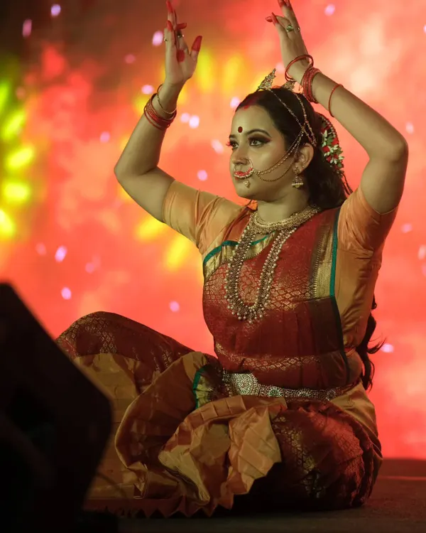 A powerful pose from a dance drama, where the makeup helps bring the character of 'Draupadi' to life. The look is designed to be expressive and dramatic.