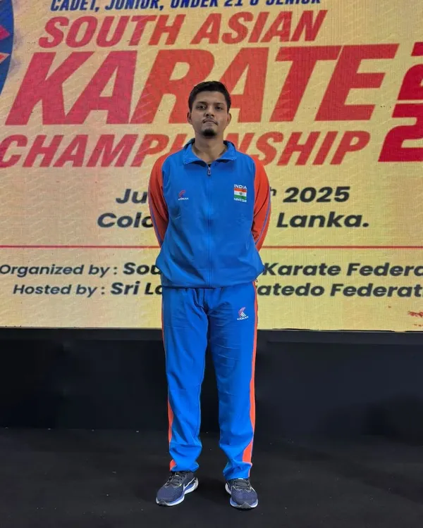 Jitendra Kumar representing India at the 9th South Asian Karate Championship in Colombo, Sri Lanka. His focus and preparation are evident before the match.