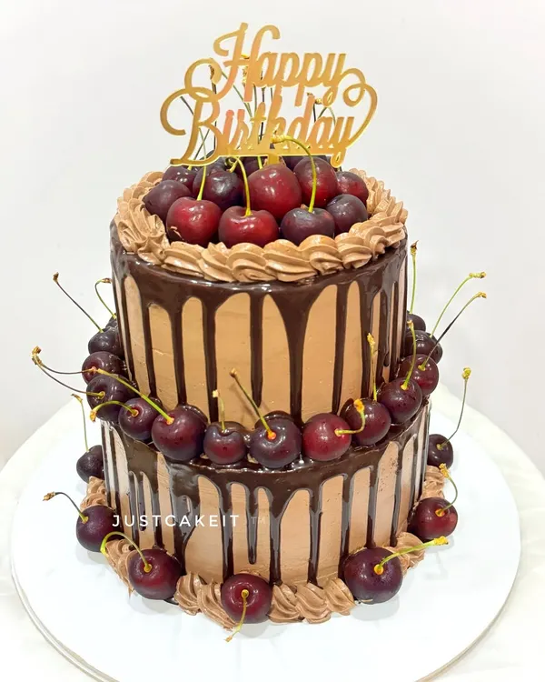 A last-minute, two-tier chocolate cake absolutely loaded with fresh cherries. I was so impressed that my client dared to take this tall cake in an auto rickshaw, and it arrived perfectly.