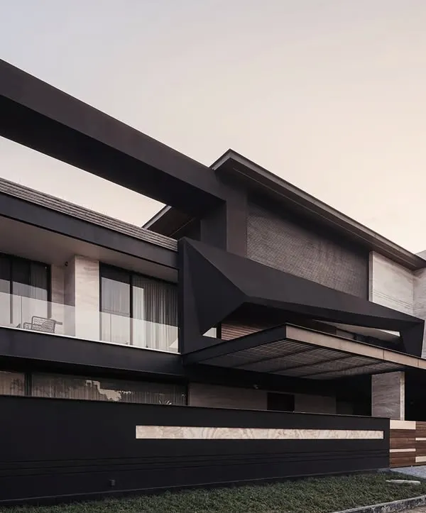 The Carbonado residence in Panipat, seen here at dusk, showcases our use of bold, angular forms and dramatic lighting. Inspired by the black diamond, its design is a play of solid and void, creating a powerful silhouette that is both sleek and imposing.