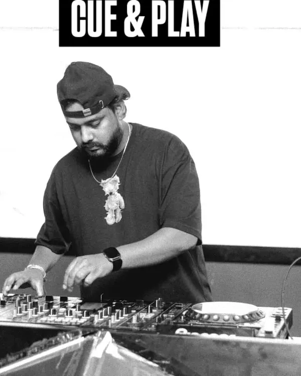 A black and white shot showing the "Cue & Play" moment. This is where the magic starts, lining up the next track to create a smooth transition.