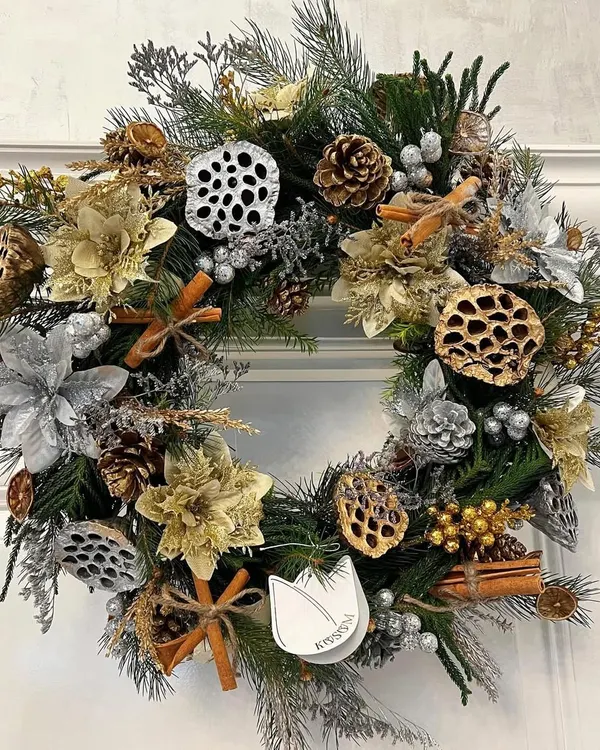 My Moonlit Gilded Wreath is magical, sparkly, and so Christmassy. It features silver and gold foliage, lotus pods, pinecones, and cinnamon sticks for a festive and classy look that will dazzle on any door.