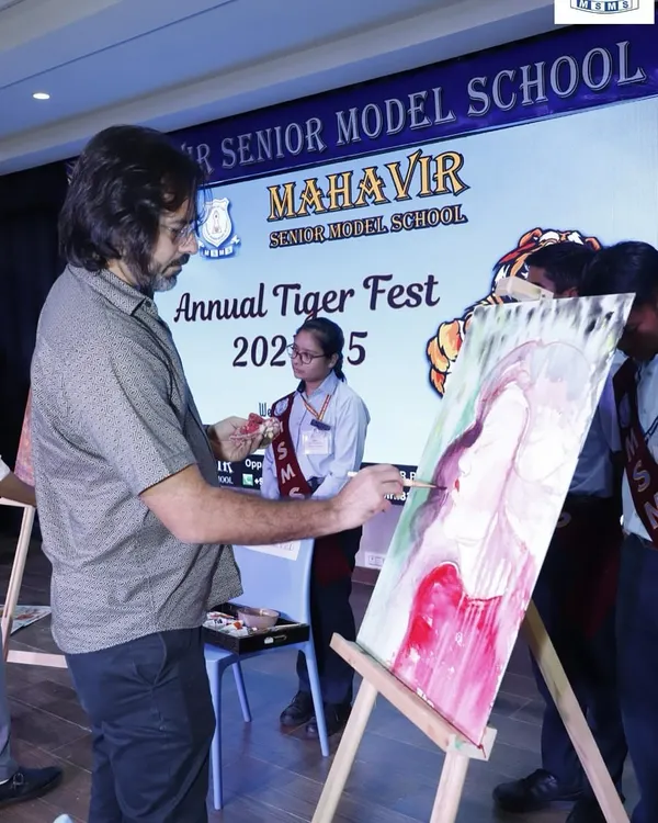 This is the live painting experience in action at the Mahavir Senior Model School's Tiger Fest. I work on an easel with oil paints, allowing guests to watch the creative process unfold in real time, making it an engaging spectacle for any event.
