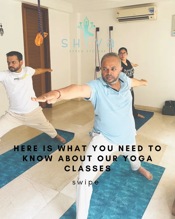 This is what our classes are all about: a community of individuals moving and breathing together. Here, students practice Virabhadrasana II (Warrior II) with focus and determination.