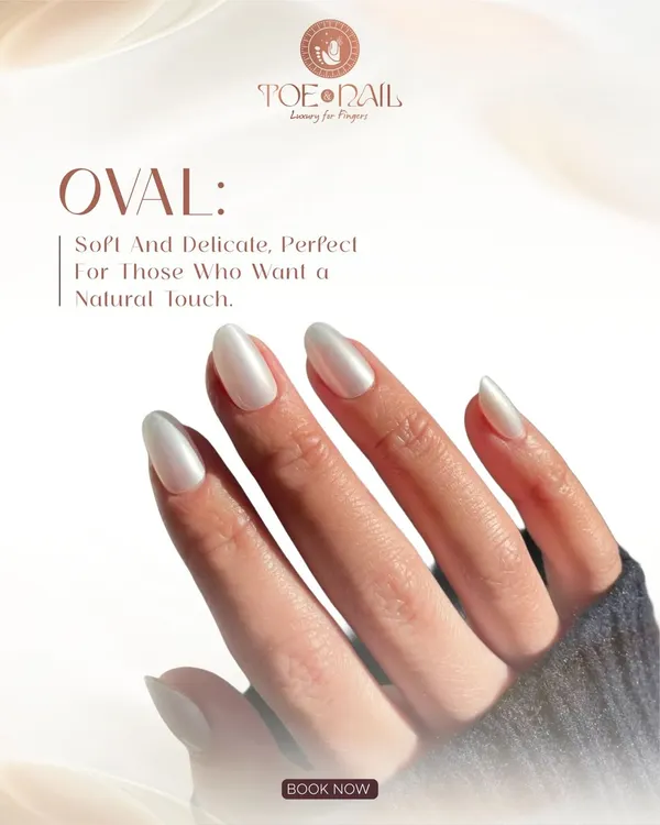 A perfect example of the "glazed donut" trend in a soft, pearly white. These oval-shaped nails have a beautiful, iridescent sheen that is both trendy and elegantly understated.