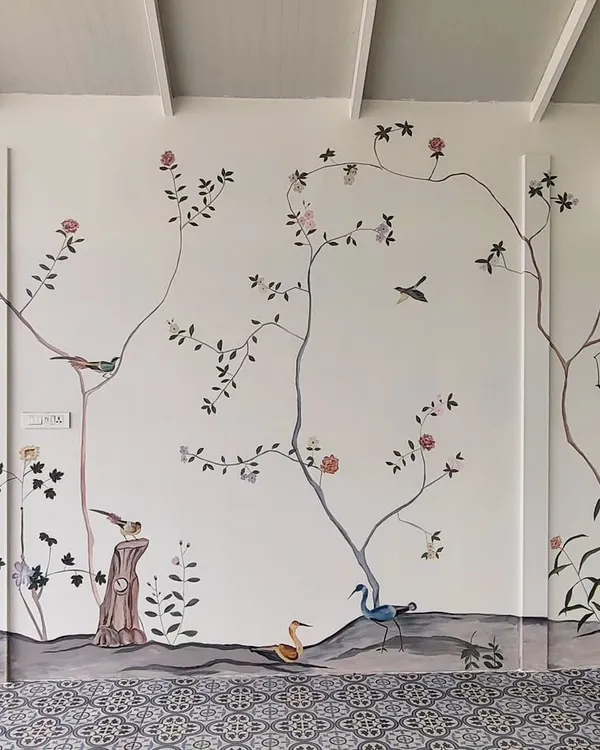 This expansive French-themed mural, painted in a villa in Tirupur, Tamil Nadu, brings the tranquility of nature indoors. The design features delicate branches, birds, and flowers, creating a serene and elegant atmosphere.