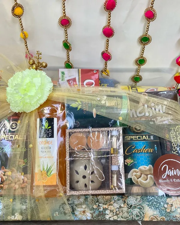 One of my favourite Diwali hampers, beautifully wrapped and ready to gift. It includes premium cashews, cookies, and an aroma diffuser set for a touch of luxury.