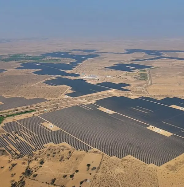 An expansive aerial view of our pioneering open-access solar plant, Project JAI, connected to the national grid. This facility is engineered to provide businesses across India with access to renewable energy, irrespective of their geographical location.