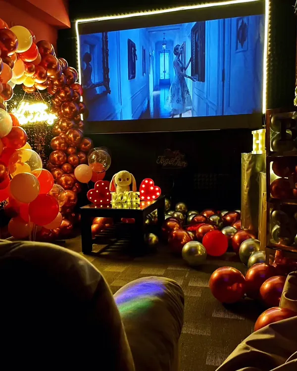 This is the vibe I want you to experience. Imagine settling into a comfy recliner, surrounded by decorations for your special day, with your favorite movie on a massive 120-inch screen. This setup was for a horror movie night combined with a birthday, creating a truly unique celebration.