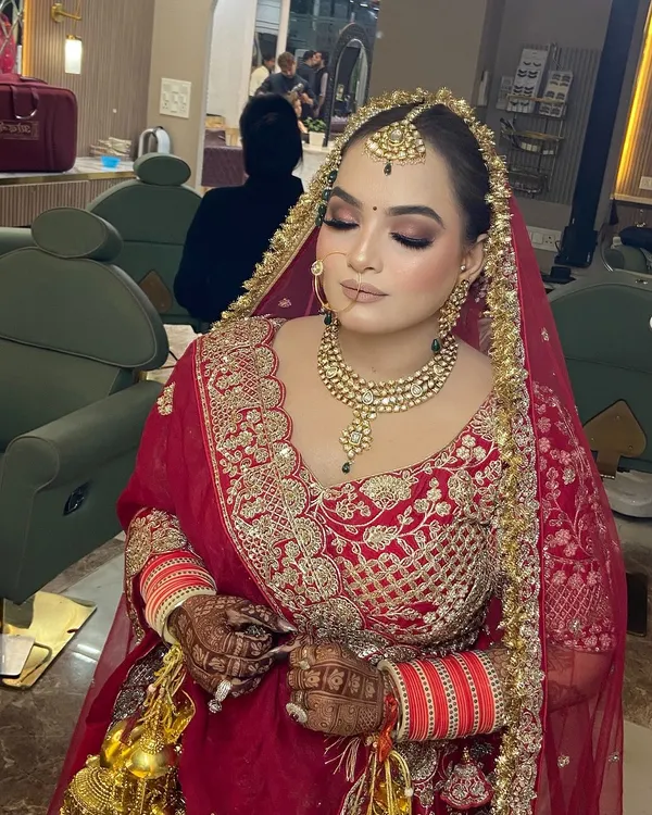 My beautiful bride Dipika, looking absolutely regal. For her wedding day, we created a classic bridal look with soft brown smokey eyes and a flawless base to complement her stunning red lehenga.