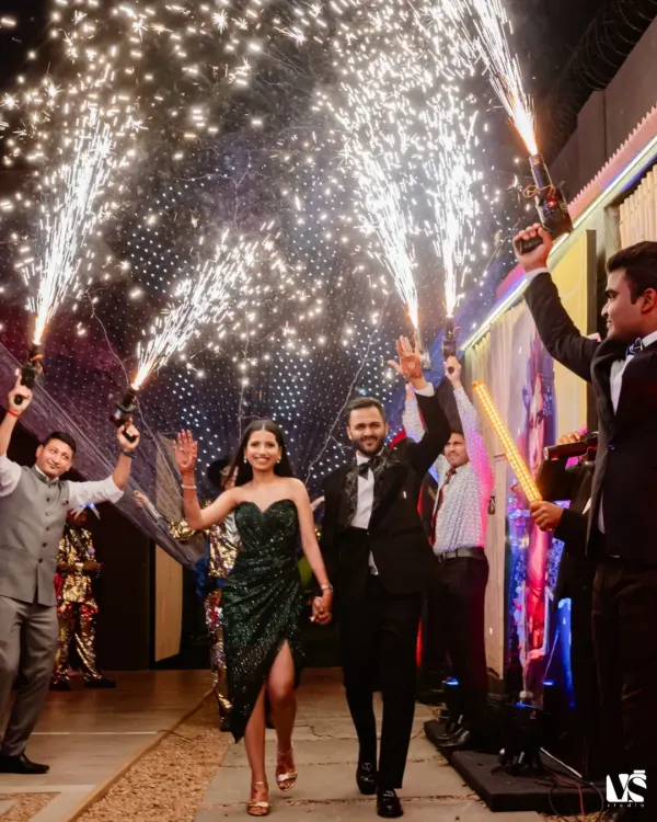 The grand entrance. Shruti and Divyansh make their way into the party through a tunnel of sparklers, a truly cinematic start to an unforgettable night of celebration.