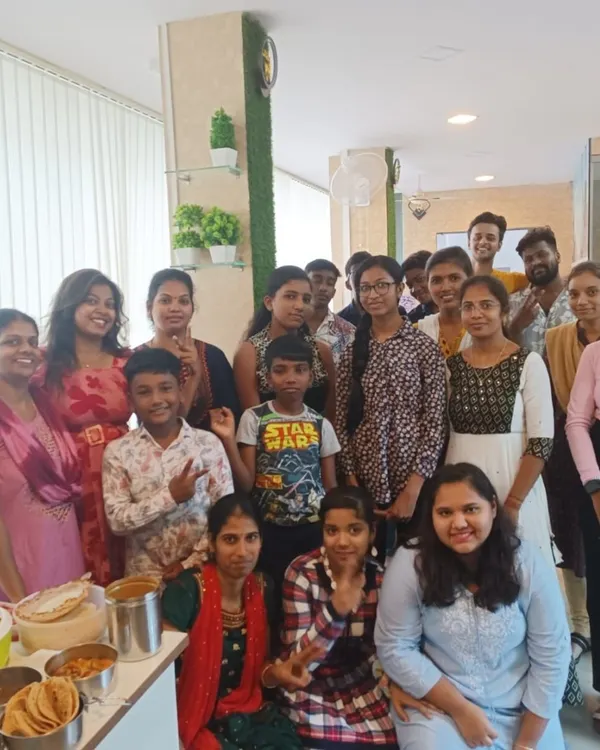 A happy group photo from one of our potluck events, featuring students of all ages, including our young learners. These gatherings are perfect for building a supportive and interactive learning community.
