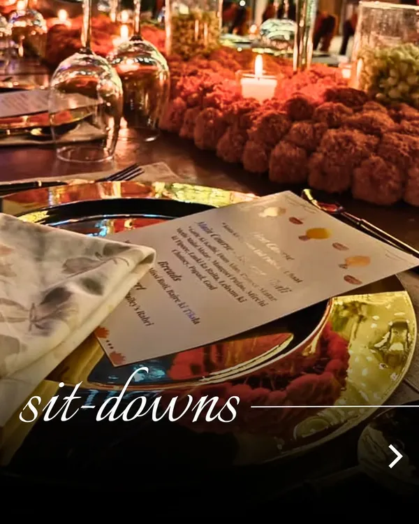 The setting for an unforgettable meal. We pay attention to every detail, from the custom menu cards to the elegant table decor, to create a truly special sit-down dinner experience.