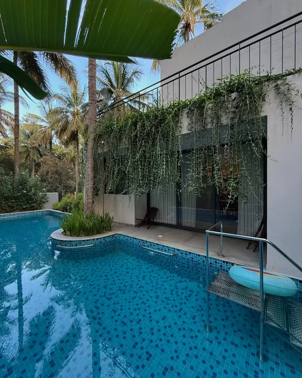 A tranquil poolside escape where cascading greenery meets modern architecture. I designed this space to feel like a private resort, using lush foliage to create privacy and a sense of calm.